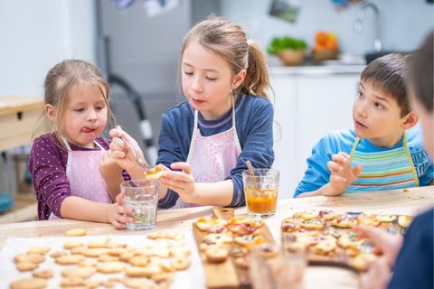 Children decorating cookies