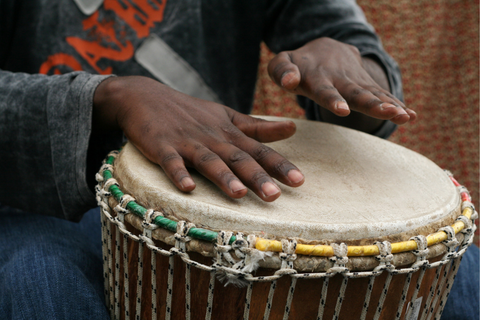 Hands playing a drum