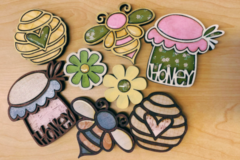 Several wooden magnets laying on a table