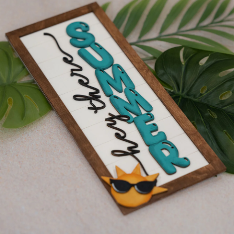 a wooden sign with the word summer on it