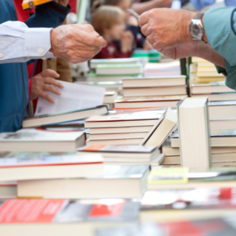 people buying books at a book fair