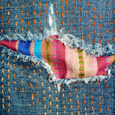 a close up of a hole in a pair of jeans