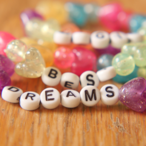 a bracelet with the words dreams written on it