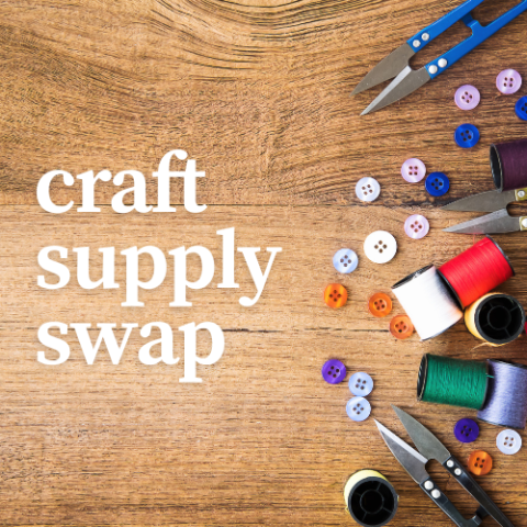 many different types of sewing supplies laid out on a wooden table