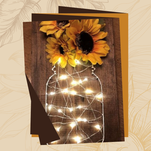 sunflowers in a mason jar with string lights