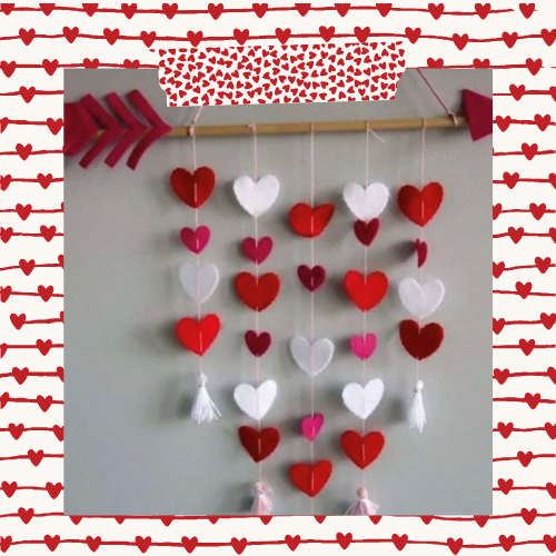 a valentine's day mobile hanging on a wall