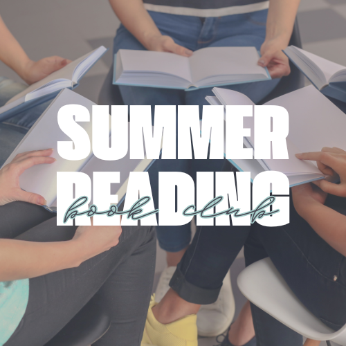 a group of people sitting around a table with books